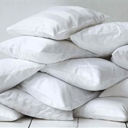 Someone Holding at Least Twelve Pillows