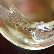 Glass Flows at Room Temperature as High-Viscosity Liquid