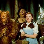 Dorothy, Scarecrow, Tin-Man, and Cowardly