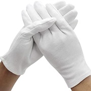 Lotion on Hands Covered by Cotton Gloves