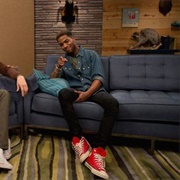 7. Kid Cudi Wears a Denim Shirt and Red Sneakers