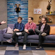 2. the Lonely Island Wear Dark Pants and Eyeglasses