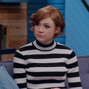 19. Karen Gillan Wears a Black and White Striped Pullover and Coral Skirt