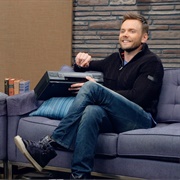 13. Joel Mchale Wears a Navy Zip-Up and High Tops