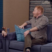 8. Jesse Tyler Ferguson Wears a Brown Checked Shirt and Stripey Socks