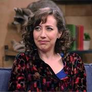 9. Kristen Schaal Wears Strawberry Colored Pants and a Multicolored Shirt