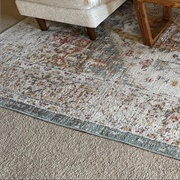 Area Rug Over Beige Carpet