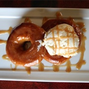 Two Donuts With Ice Cream and Ice Cream Topping