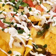 Marble Cheddar, Tomato, Celery, Capocollo, Frank&#39;s Redhot Sauce, and Sour Cream Nachos