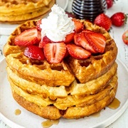 Chocolate Chip Waffle With Maple Syrup, Blueberry Syrup, and Strawberry Syrup