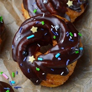 Glazed Cookie Dough-Filled Chocolate Cruller With Chocolate Chips