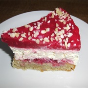 Vegan Raspberry Cake With Rum Cream and Chopped Almonds