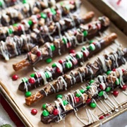 Chocolate-Covered Caramel Pretzel Sticks With Holiday Sprinkles