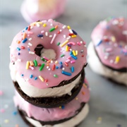 Strawberry Iced and Cream-Filled Ring Donut With Chocolate Chips