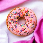 Rose Iced and Chocolate-Filled Donut With Sprinkles