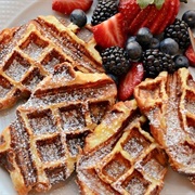 Blueberry Strawberry Waffle With French Toast and Maple Syrup