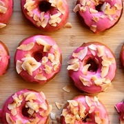 Rose Iced and Strawberry Jelly-Filled Chocolate Donut With Coconut