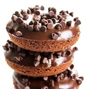 Chocolate Iced and Chocolate-Filled Donut With Chocolate Chips