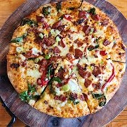 Mozzarella Andouille Bacon Potato and Red Onion Pizza