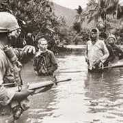 US Troops Move Vietcong Suspects Across River