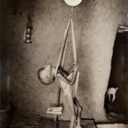 A Child Being Weighed (Sebastião Salgado)