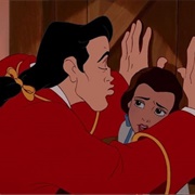 Belle Kicking Gaston Out of Her House