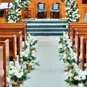 Aisle Lined With Short Flower Arrangements